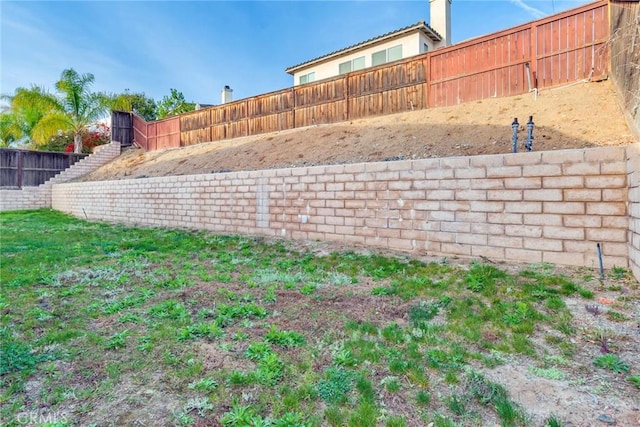 view of yard with a fenced backyard