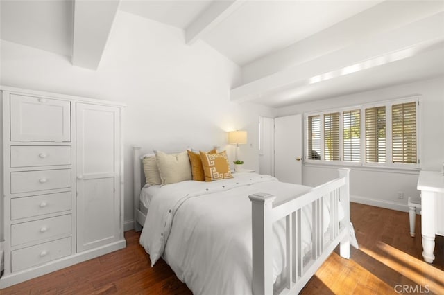 bedroom featuring vaulted ceiling with beams, wood finished floors, and baseboards