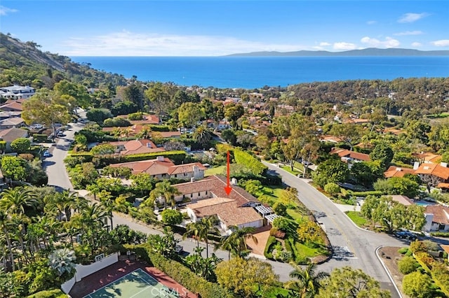 birds eye view of property featuring a residential view and a water and mountain view