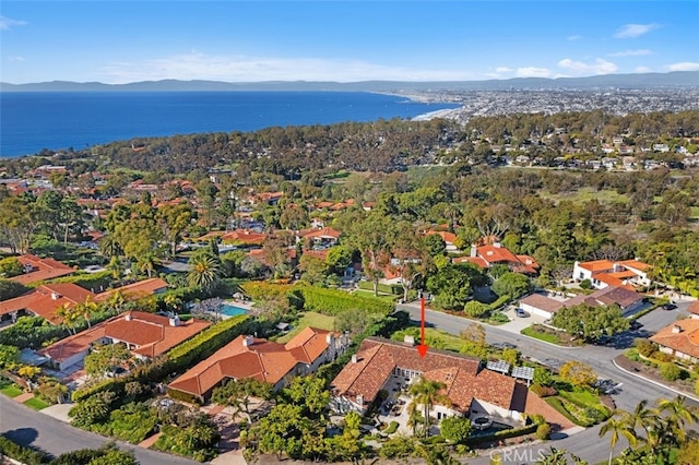 bird's eye view with a residential view and a water and mountain view