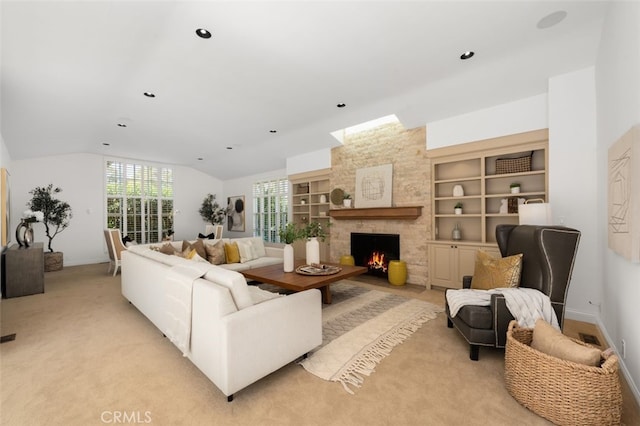 living area with recessed lighting, built in shelves, a fireplace, and vaulted ceiling