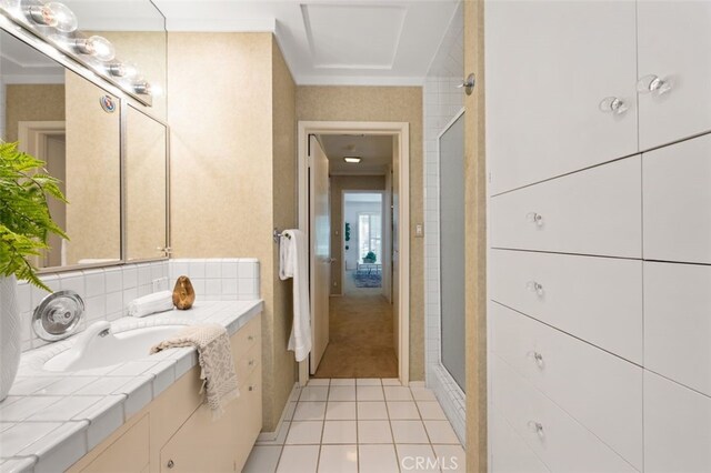 full bath with vanity, tile patterned floors, tasteful backsplash, and a shower stall