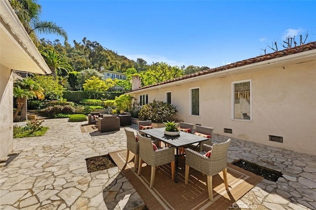 view of patio / terrace featuring an outdoor living space and outdoor dining area