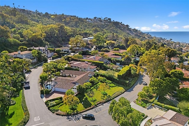 drone / aerial view featuring a residential view and a water view