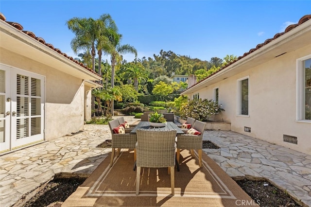 view of patio featuring outdoor dining area