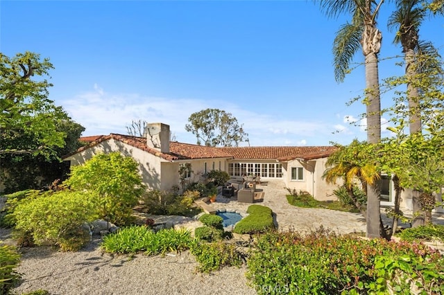 back of property featuring stucco siding and a patio