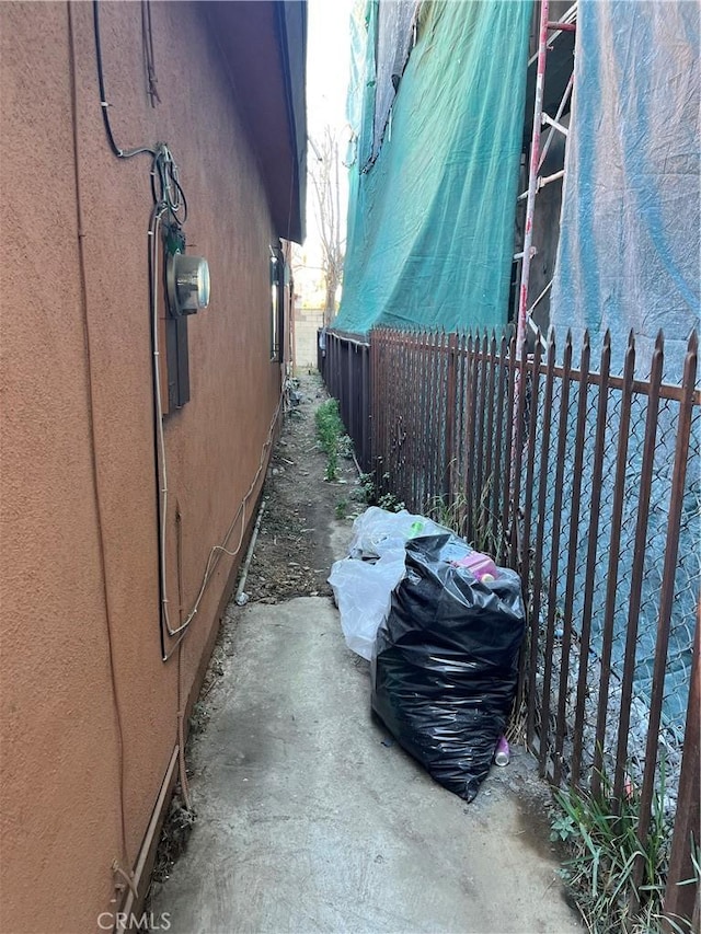 view of side of property with fence