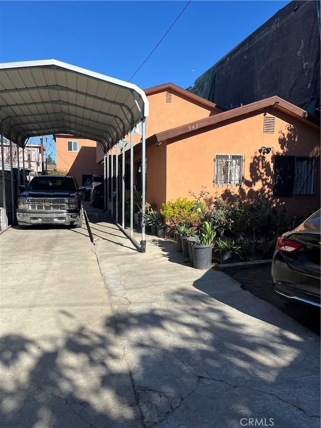 view of car parking with a carport