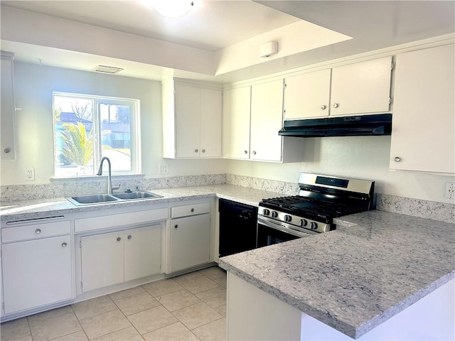 kitchen featuring gas stove, white cabinetry, a sink, a peninsula, and under cabinet range hood