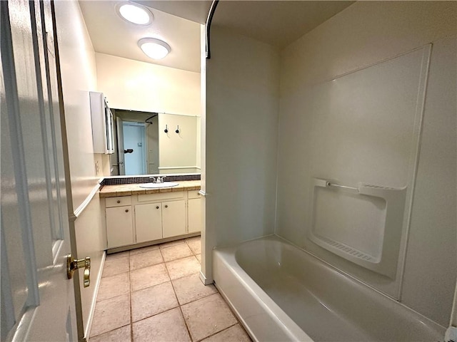 bathroom with  shower combination, vanity, and tile patterned floors