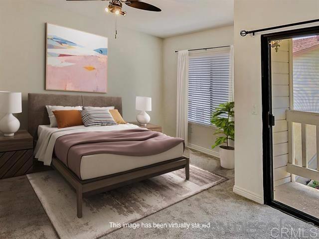 bedroom with a ceiling fan, carpet, and baseboards