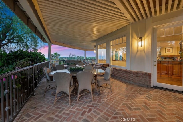 patio terrace at dusk with outdoor dining area