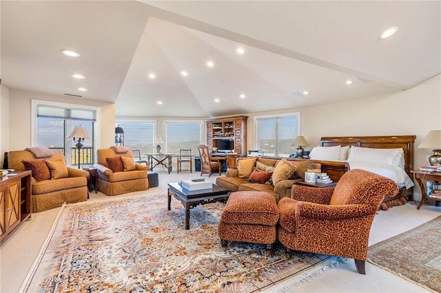 living area featuring light carpet, lofted ceiling, visible vents, and recessed lighting