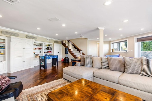 living room with visible vents, ornamental molding, dark wood-type flooring, stairs, and recessed lighting