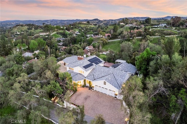 birds eye view of property with a mountain view