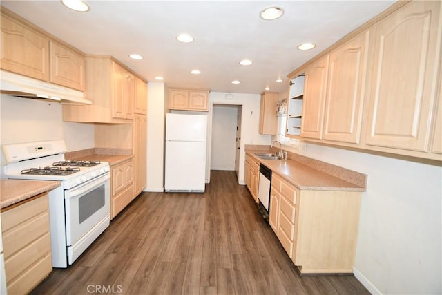 kitchen featuring under cabinet range hood, white appliances, a sink, light countertops, and light brown cabinetry