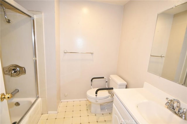 full bath featuring toilet, vanity, baseboards, shower / washtub combination, and tile patterned floors