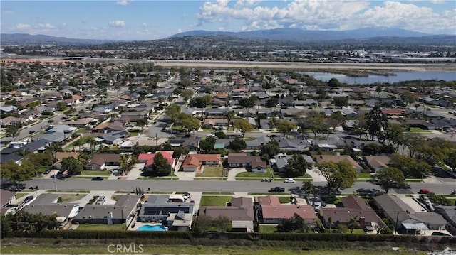 birds eye view of property with a residential view and a water and mountain view