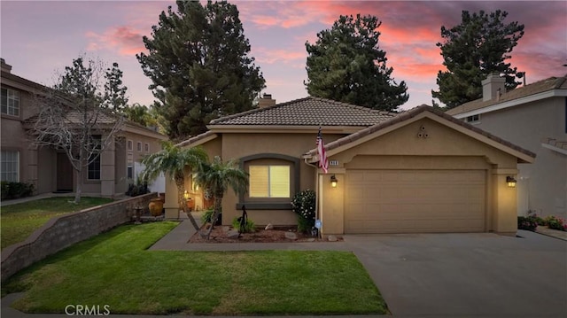 view of front facade featuring a chimney, stucco siding, concrete driveway, a garage, and a front lawn