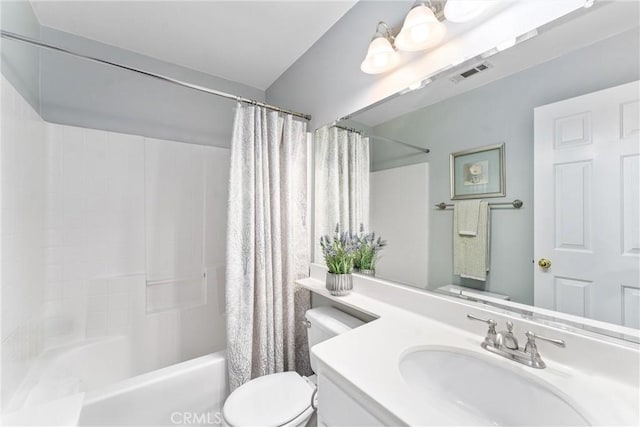 bathroom with shower / bath combo, visible vents, vanity, and toilet