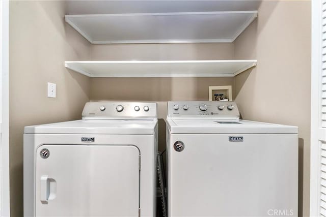 clothes washing area with laundry area and washing machine and dryer