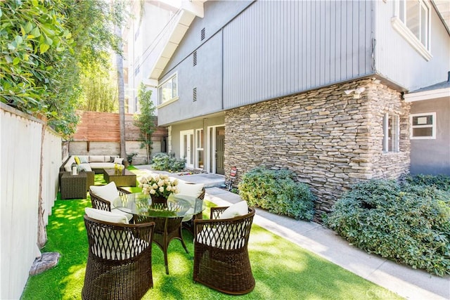 view of patio featuring a fenced backyard and an outdoor living space