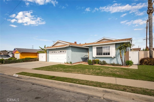 ranch-style house with stucco siding, concrete driveway, fence, a garage, and a front lawn