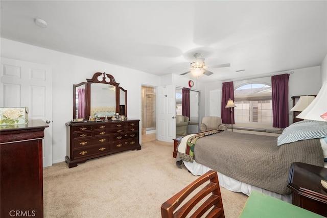 bedroom with a baseboard radiator, ceiling fan, baseboards, and light colored carpet