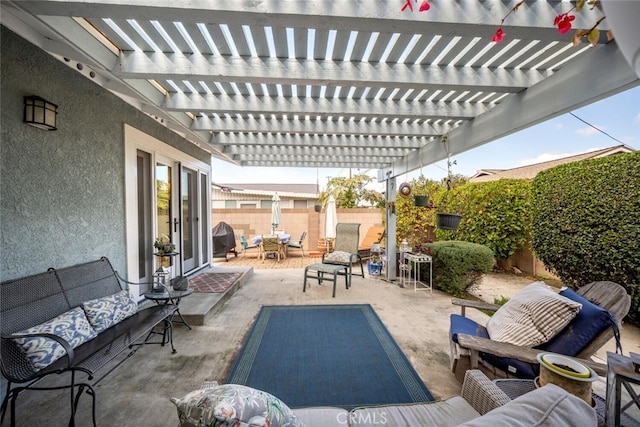 view of patio / terrace featuring outdoor lounge area, a fenced backyard, and a pergola