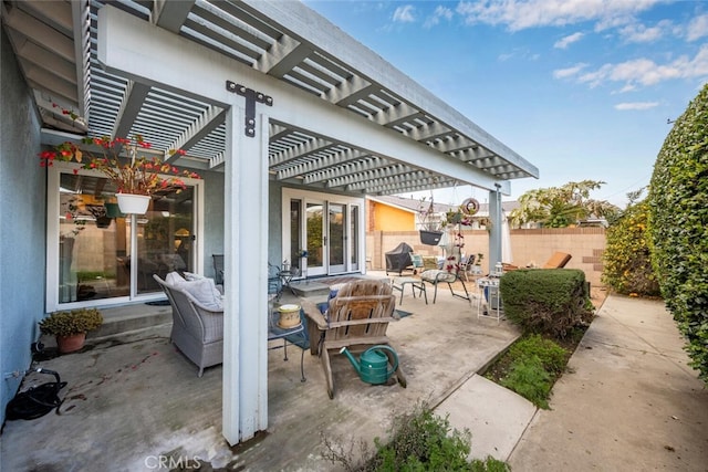 view of patio with fence and a pergola