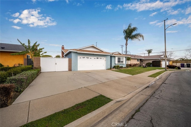 ranch-style house featuring stucco siding, an attached garage, a gate, driveway, and a front lawn