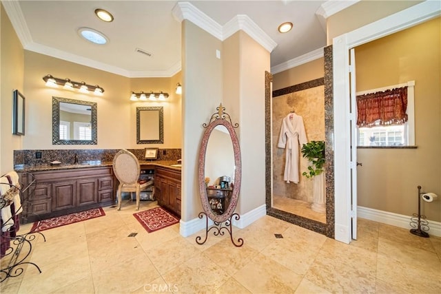 bathroom with vanity, ornamental molding, visible vents, and walk in shower