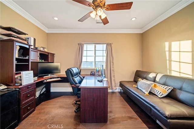 office space with visible vents, dark wood finished floors, a ceiling fan, and ornamental molding