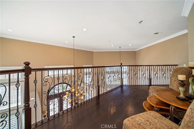 hallway featuring recessed lighting, visible vents, wood-type flooring, and crown molding