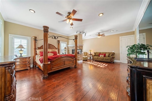 bedroom with multiple windows, crown molding, and dark wood-style flooring