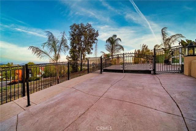 view of patio featuring a gate and fence