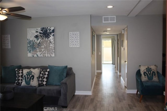 living area with recessed lighting, visible vents, a ceiling fan, wood finished floors, and baseboards