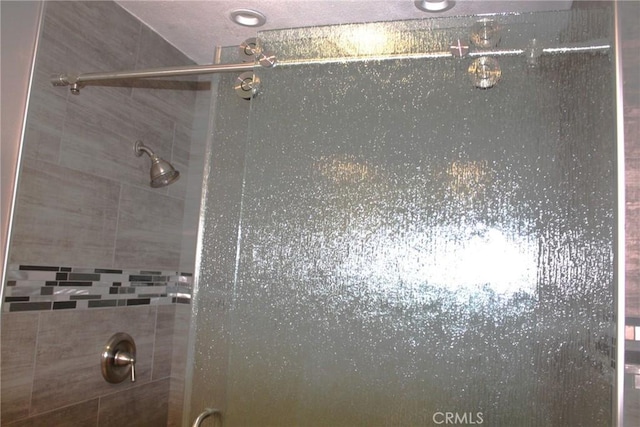 interior details featuring a shower stall