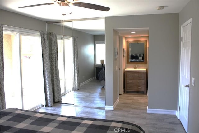 interior space featuring baseboards and wood finished floors