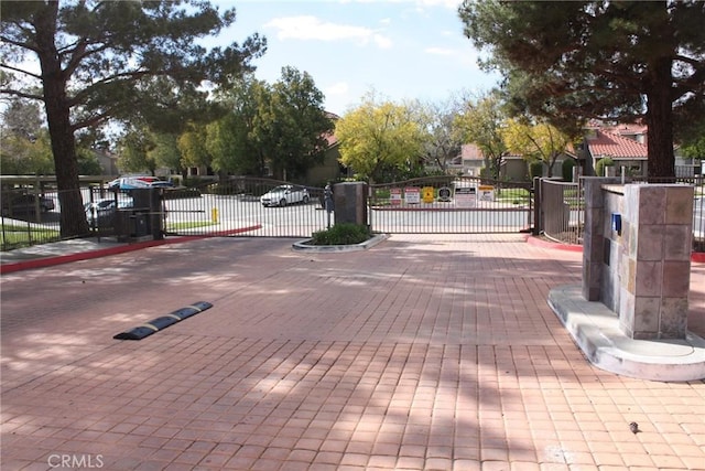 surrounding community with a gate and fence