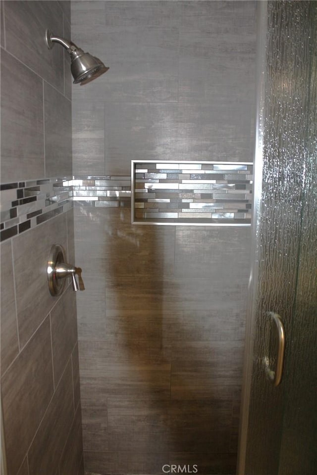 full bathroom featuring a shower stall