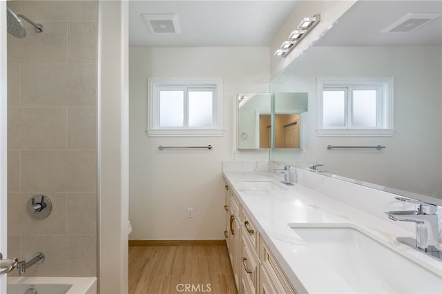 4 Singletree Ln, Rolling Hills Estates, CA 90274 - full bath featuring double vanity, wood finished floors, shower / washtub combination, baseboards, and toilet