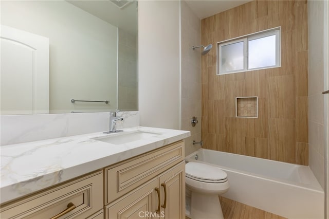 bathroom featuring vanity, toilet, and washtub / shower combination