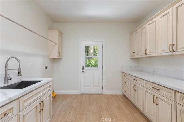 4 Singletree Ln, Rolling Hills Estates, CA 90274 - washroom with cabinet space, baseboards, washer hookup, and light wood-style flooring