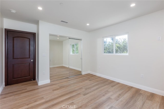 4 Singletree Ln, Rolling Hills Estates, CA 90274 - unfurnished bedroom featuring light wood-type flooring, a closet, recessed lighting, and baseboards