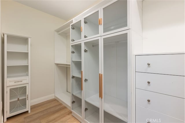 mudroom with light wood-style floors and baseboards