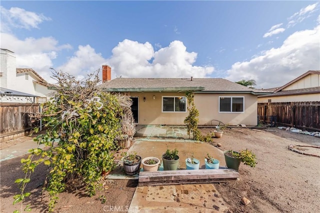 back of property featuring a patio area, a fenced backyard, and stucco siding