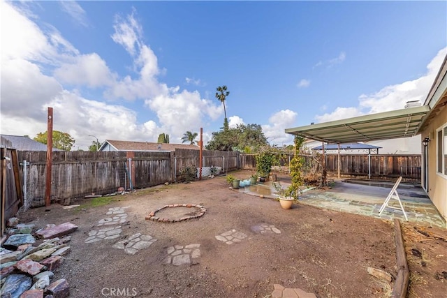 view of yard featuring a patio area and a fenced backyard