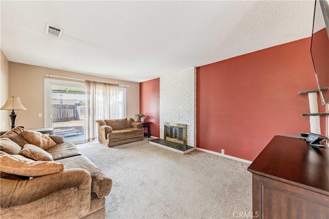 living room with a textured ceiling, visible vents, baseboards, a brick fireplace, and carpet