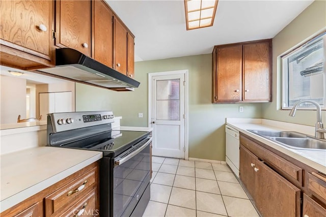 kitchen with brown cabinets, a sink, white dishwasher, stainless steel range with electric stovetop, and under cabinet range hood